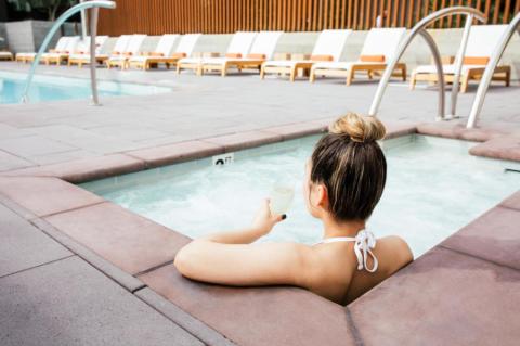 Woman in pool view Hotel San Luis