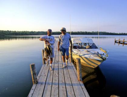 Lk Woods Fish Holding Stringer Of Fish On Dock At Sportsmans Oak Island